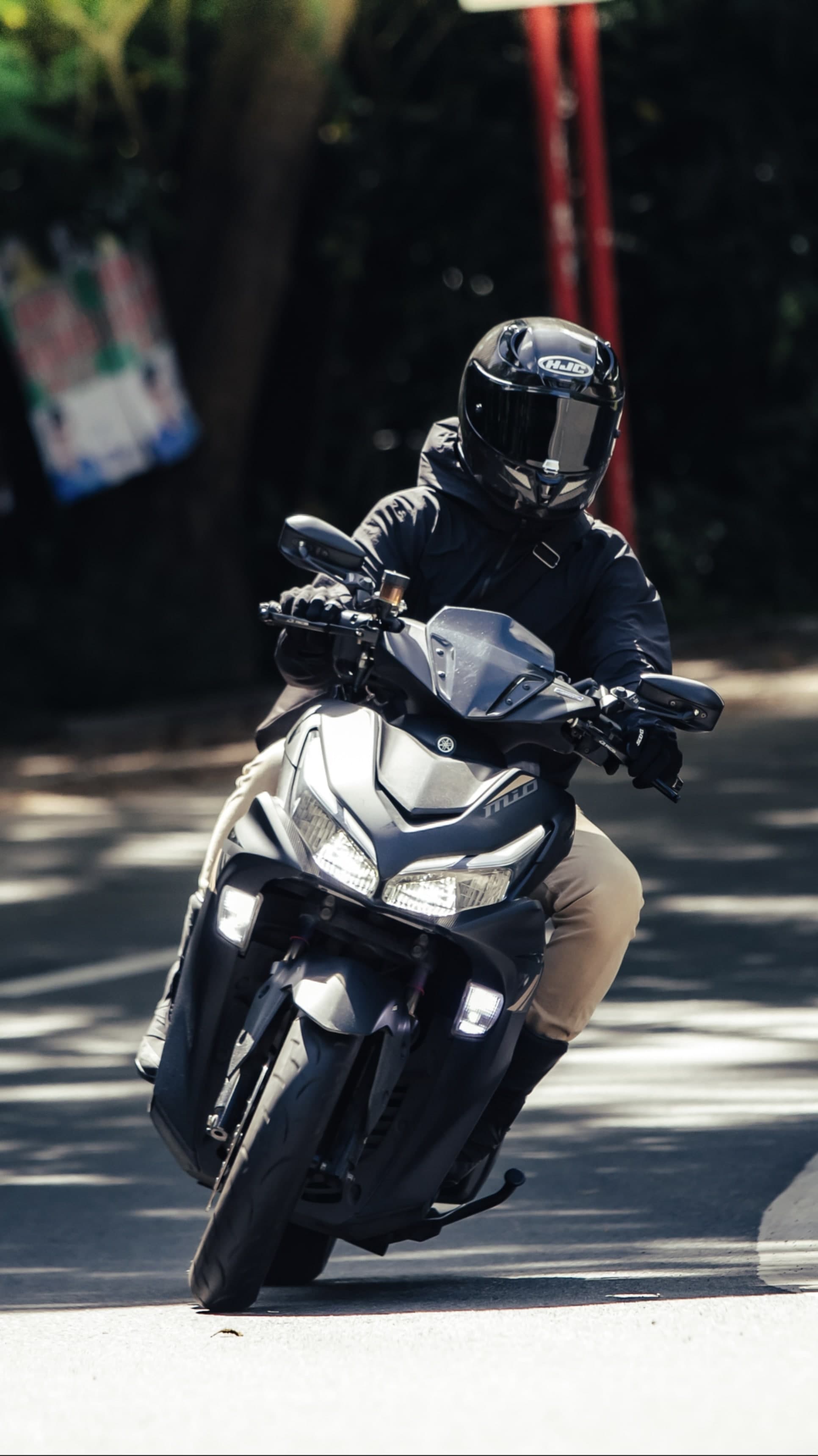 Preview: black iPhone 17 case with a sample photo of a rider on a scooter
